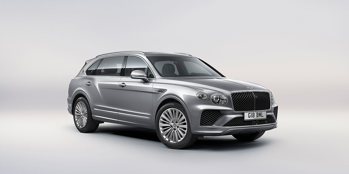 Bentley Vilnius Bentley Bentayga Extended Wheelbase luxury SUV front three quarter view in Moonbeam paint with 21 inch five spoke painted wheels