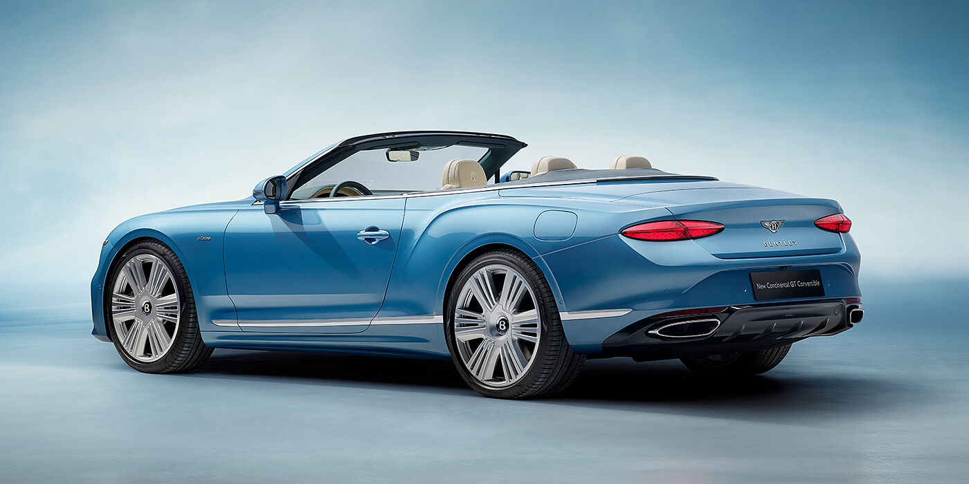 Bentley Vilnius New Bentley Continental GTC Azure convertible rear view in Light Windsor blue paint with 22 inch ten spoke wheels and chrome exterior details