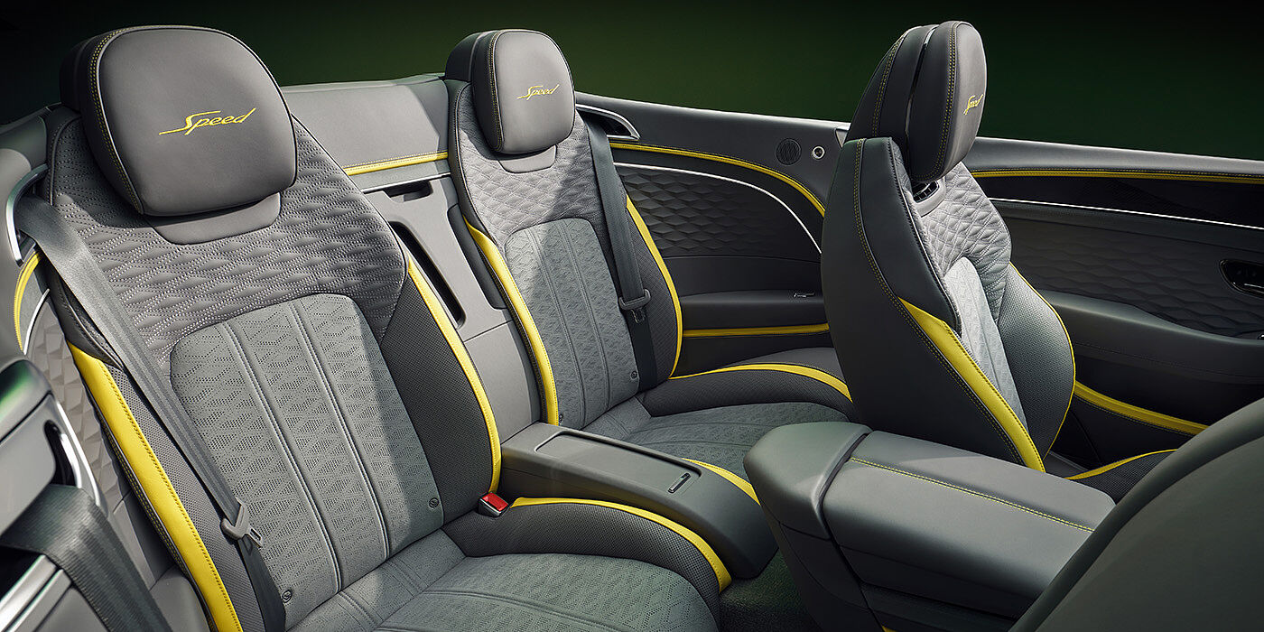 Bentley Vilnius Bentley New Continental GTC Speed convertible rear interior with unique Speed colour split in Gravity Grey and Cyber Yellow hide colours, and contrast stitched headrest emblems 