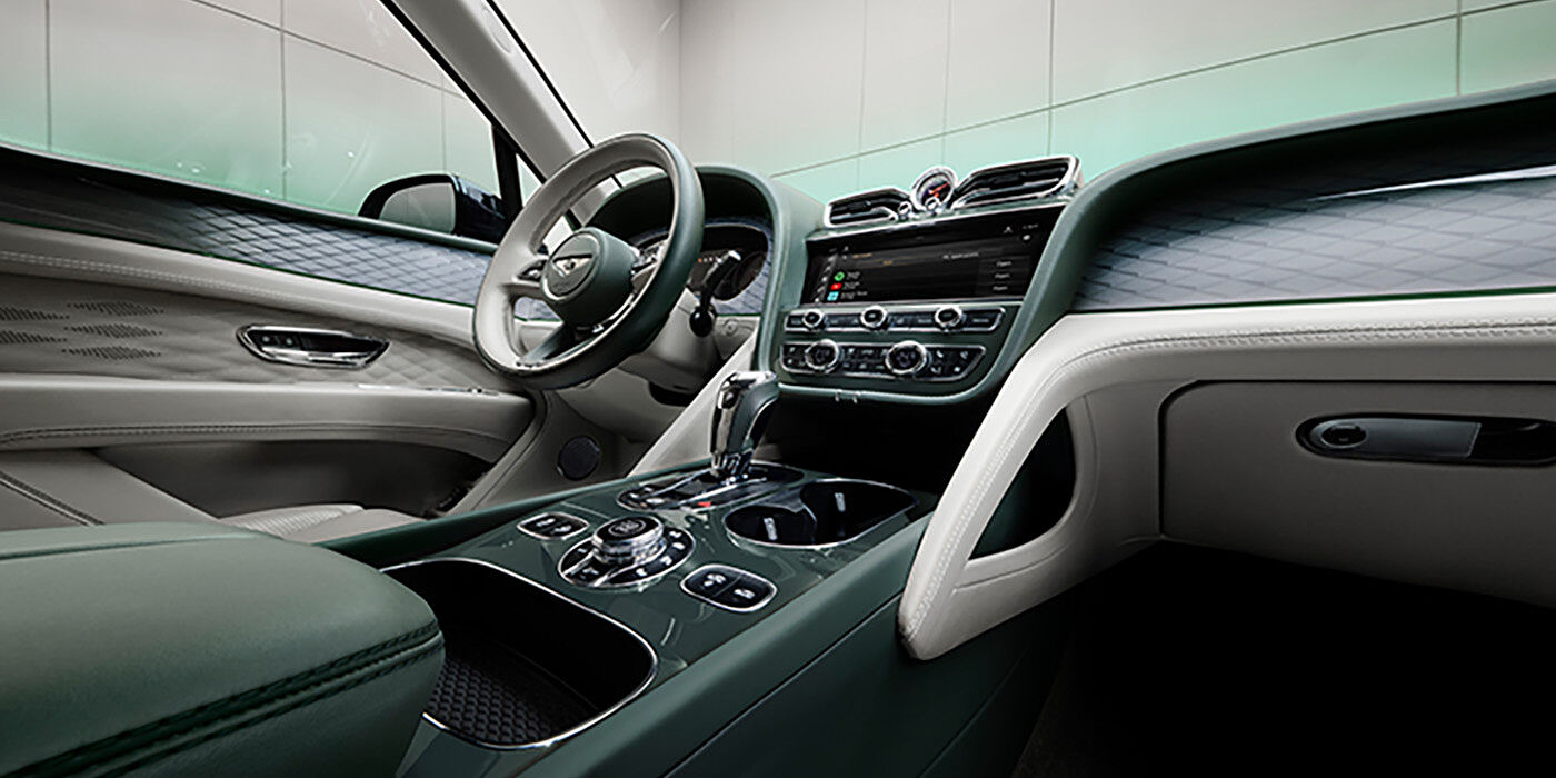 Bentley Vilnius Bentley Bentayga Atelier Edition SUV front interior in Portland and Cumbrian Green hides with Dark Tint Diamond Brushed Aluminium veneer