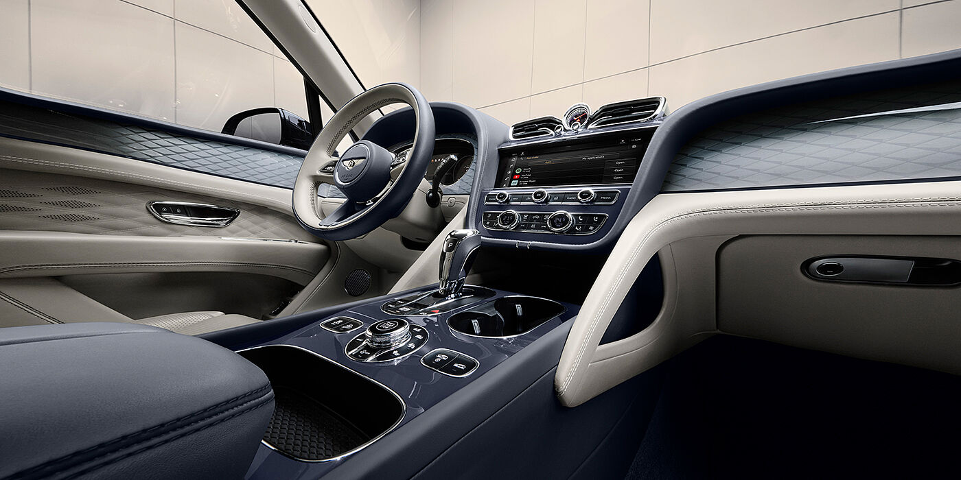 Bentley Vilnius Bentley Bentayga Atelier Edition SUV front interior in Linen and Imperial Blue hides with Dark Tint Diamond Brushed Aluminium veneer
