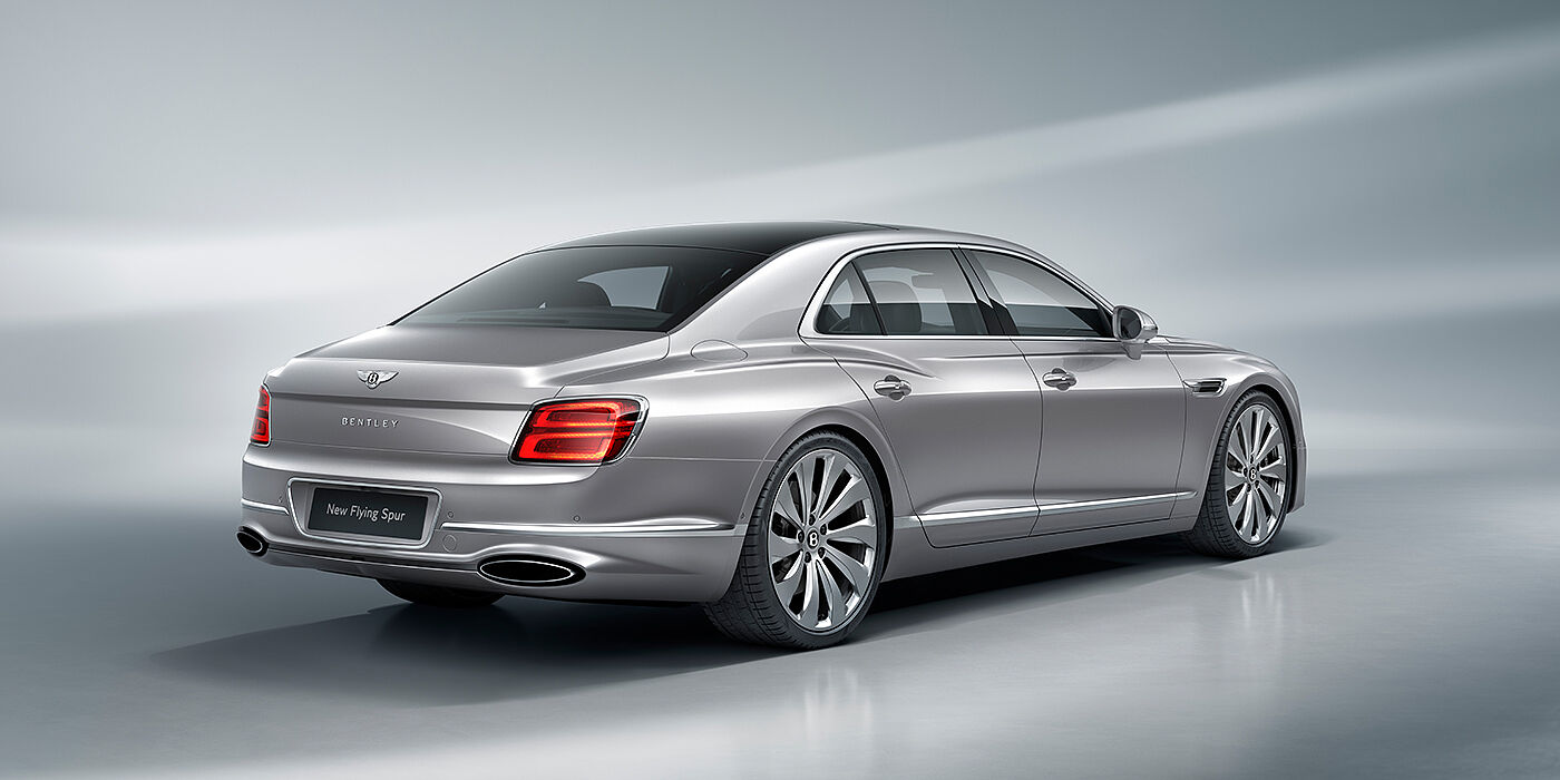 Bentley Vilnius New Bentley Flying Spur sedan rear view in Silverlake paint with ten spoke wheels and chrome matrix grille