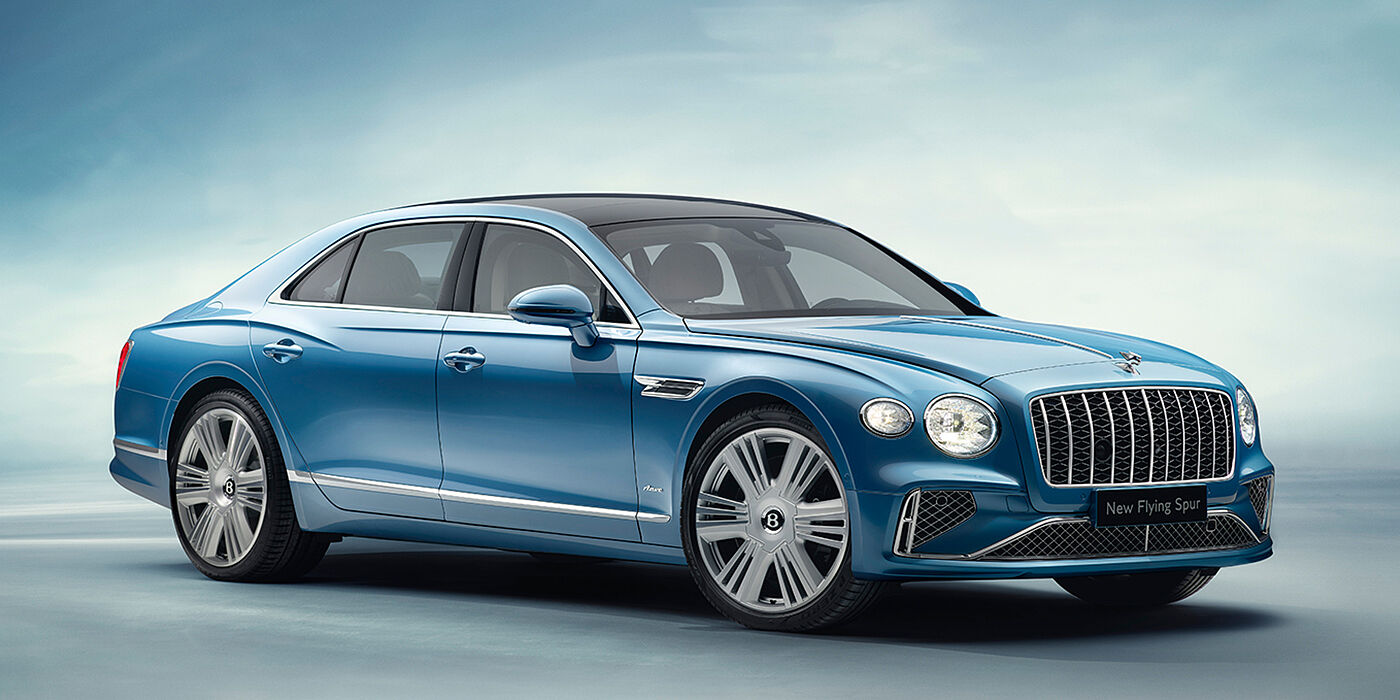 Bentley Vilnius New Bentley Flying Spur Azure sedan front view in Light windsor blue by Mulliner paint with 22 inch Azure wheels and chrome exterior details