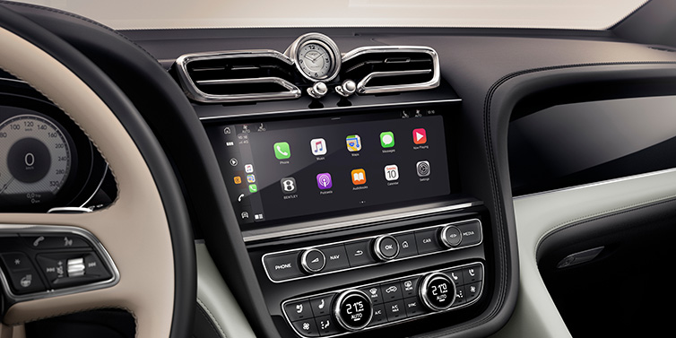 Bentley Vilnius Bentley Bentayga Extended Wheelbase Mulliner SUV front interior centre console with MMI screen showing Apps surrounded by Linen and Beluga black hide