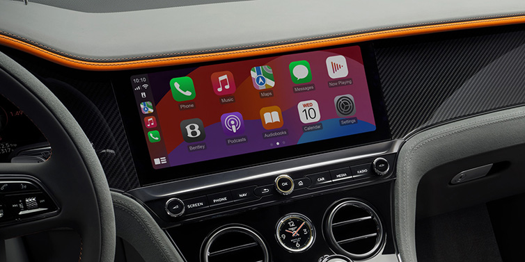 Bentley Vilnius Bentley Continental GT Speed coupe front interior centre console with MMI screen featuring Apps surrounded by Mandarin by Mulliner and Gravity Grey hides