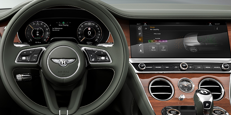 Bentley Vilnius New Bentley Continental GTC convertible front interior steering wheel view, with Beluga black leather and Crown Cut walnut veneer